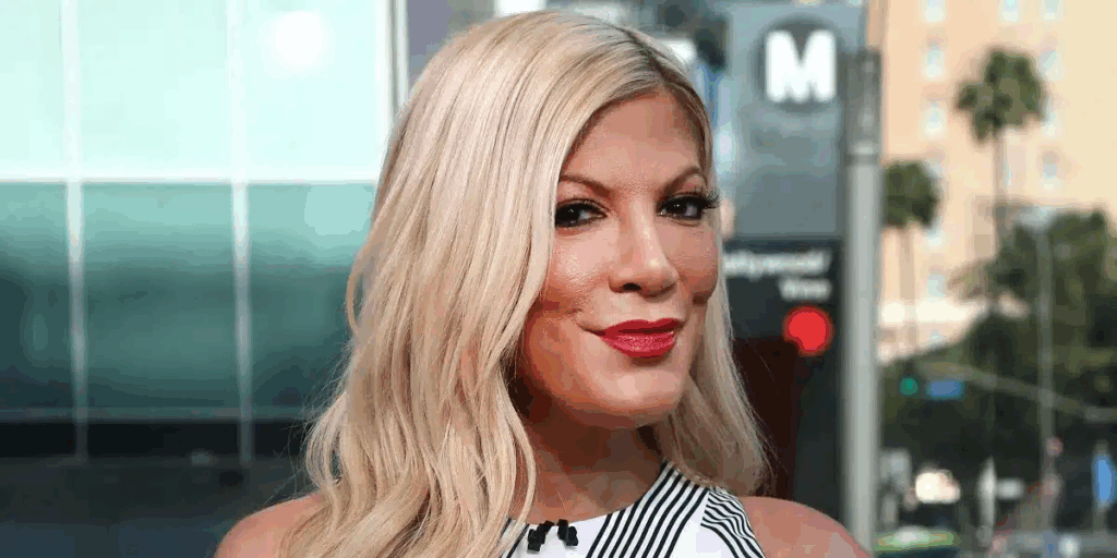 Tori Spelling’s Beach Day Backlash: Neon Two-Piece Sparks Social Media Frenzy