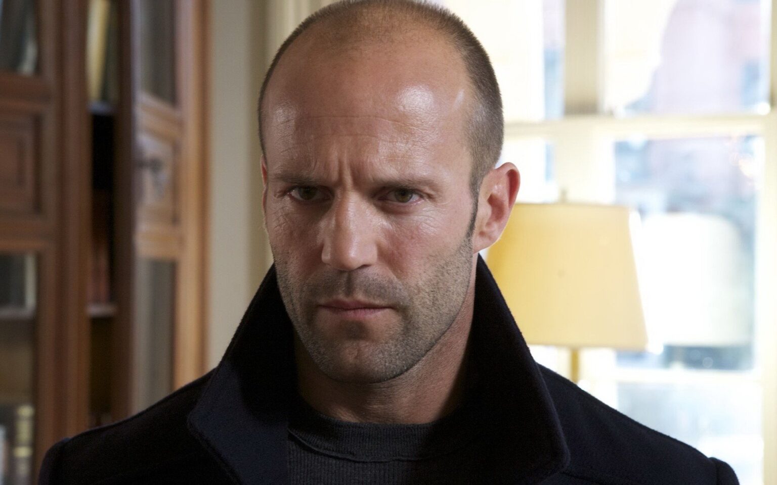 A HEARTWARMING ACT OF COURAGE: Jason Statham wades through raging floodwaters in Texas to save homeless dogs swept away by the current.
