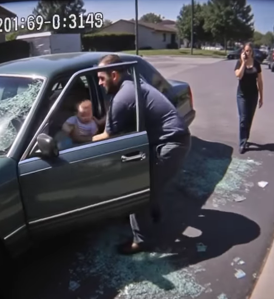 A man breaks a car window to save a baby locked inside — and you’ll